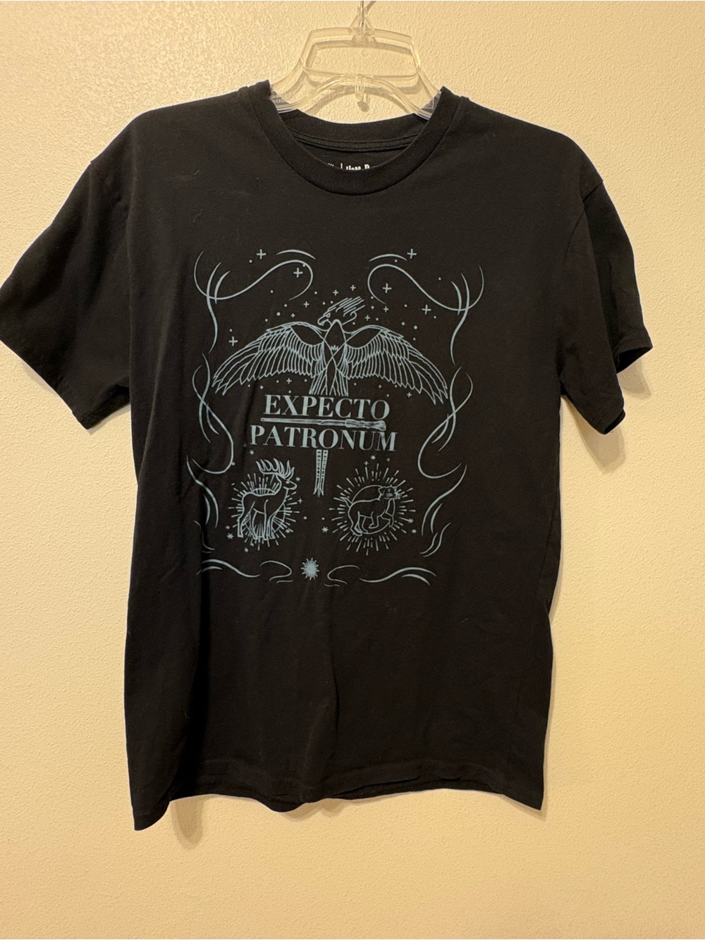 Wizarding world Black Tee with Light Blue Expecto Patronum Graphic